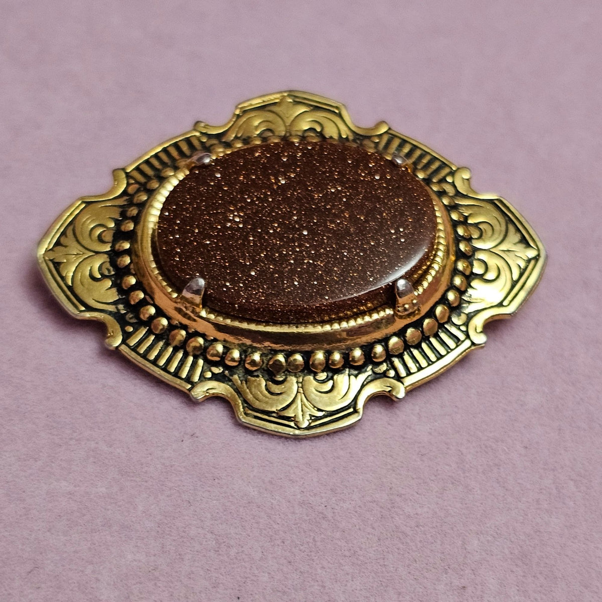 (734) Vintage Goldstone Oval Gold-Tone Ornate Brooch Classic Victorian-Inspired