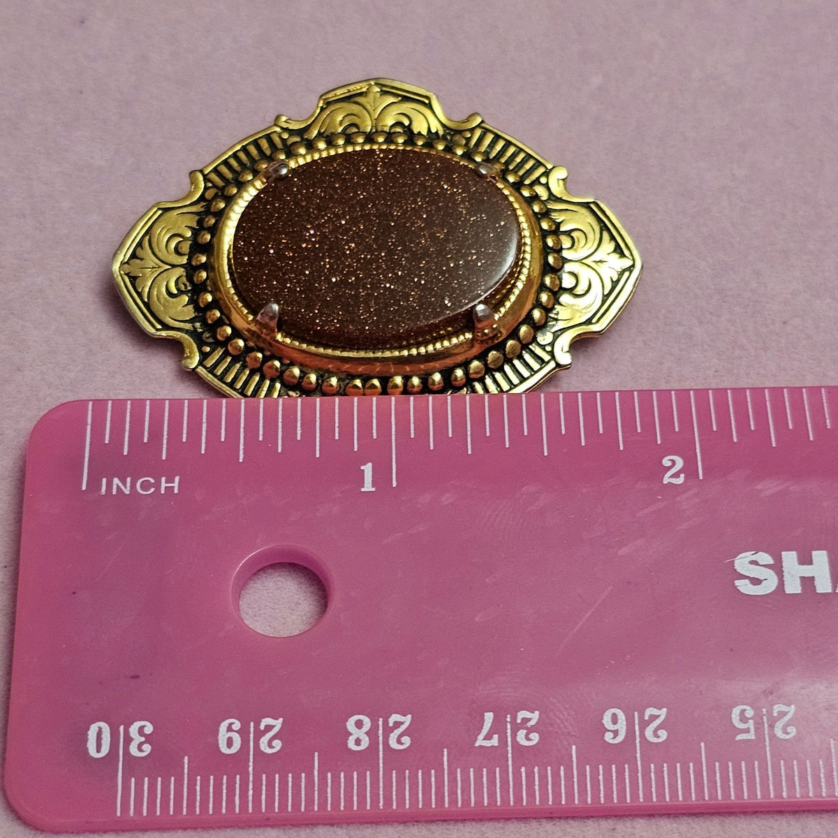 (734) Vintage Goldstone Oval Gold-Tone Ornate Brooch Classic Victorian-Inspired