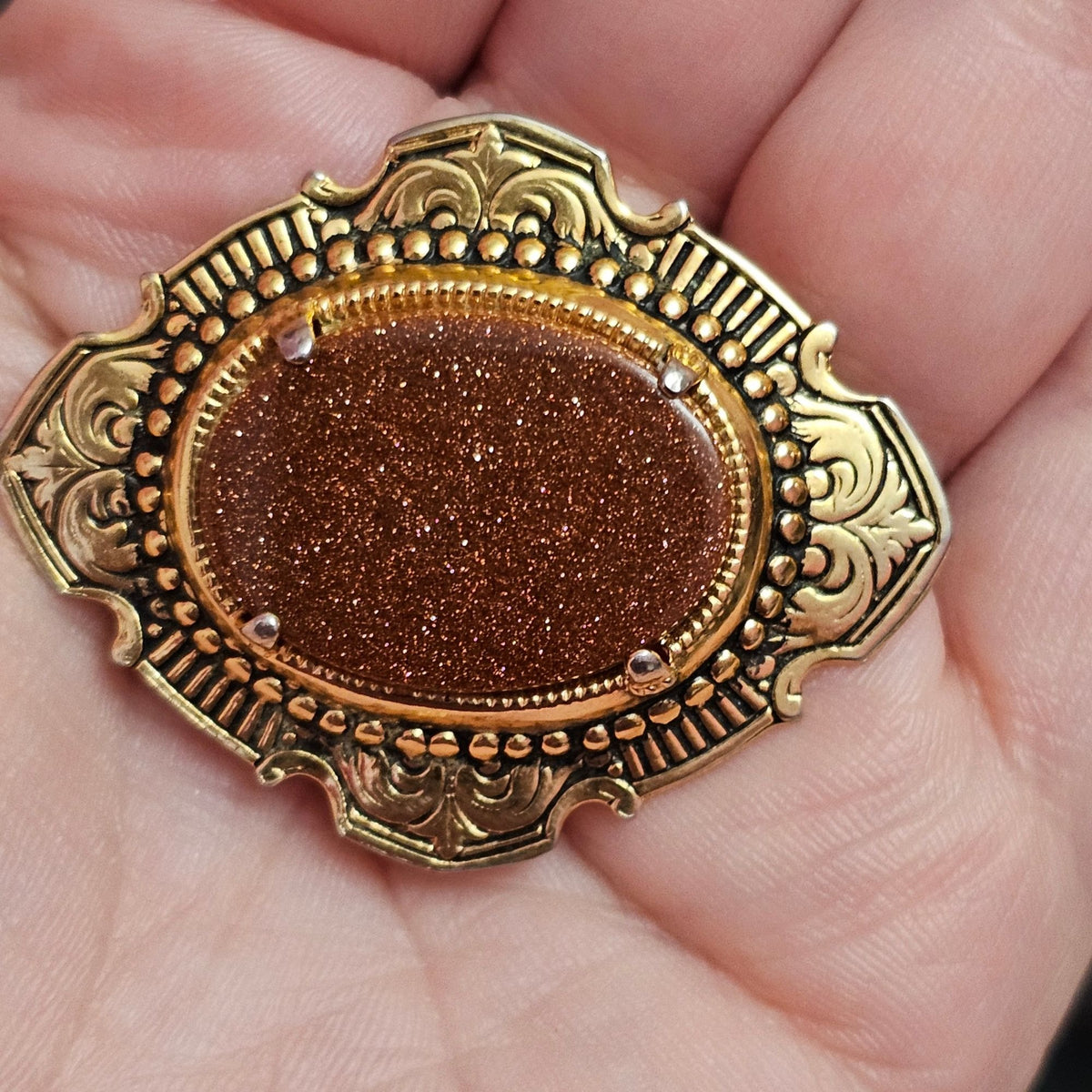 (734) Vintage Goldstone Oval Gold-Tone Ornate Brooch Classic Victorian-Inspired