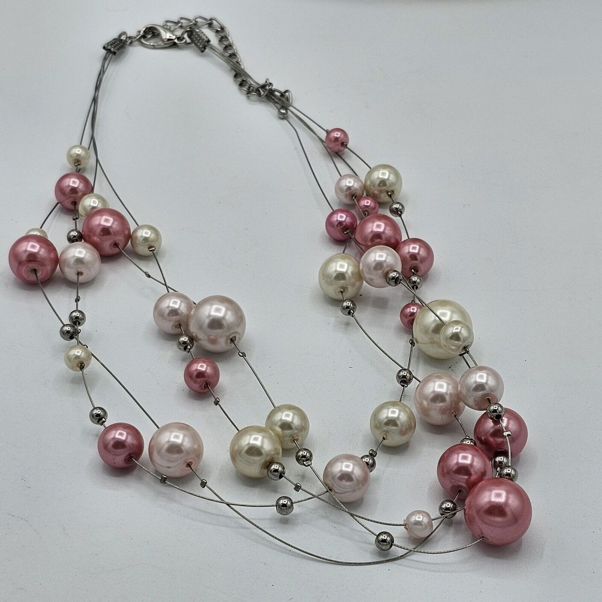 (691) Pink Cream Faux Pearl Floating Illusion Necklace 4 Strands Silver-tone Wire
